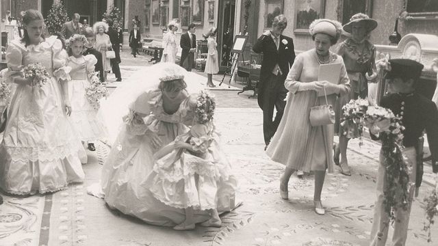 Diana pauses to speak with five-year-old bridesmaid Clementine Habro. (RR Auction)