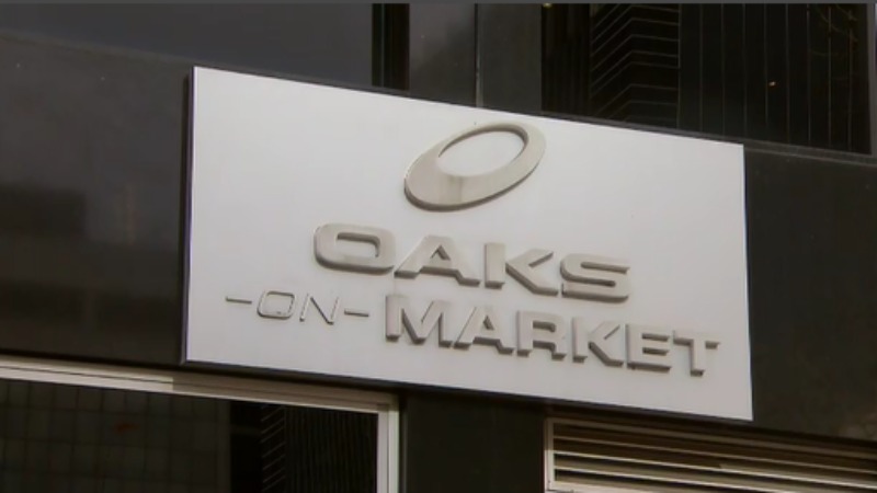 The woman's body was found at Oaks serviced apartments on Market Street. (9NEWS)