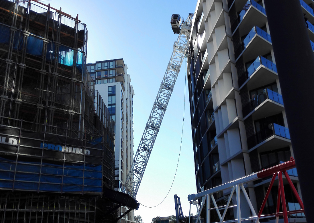 Three hurt after crane collapses onto Sydney apartment building