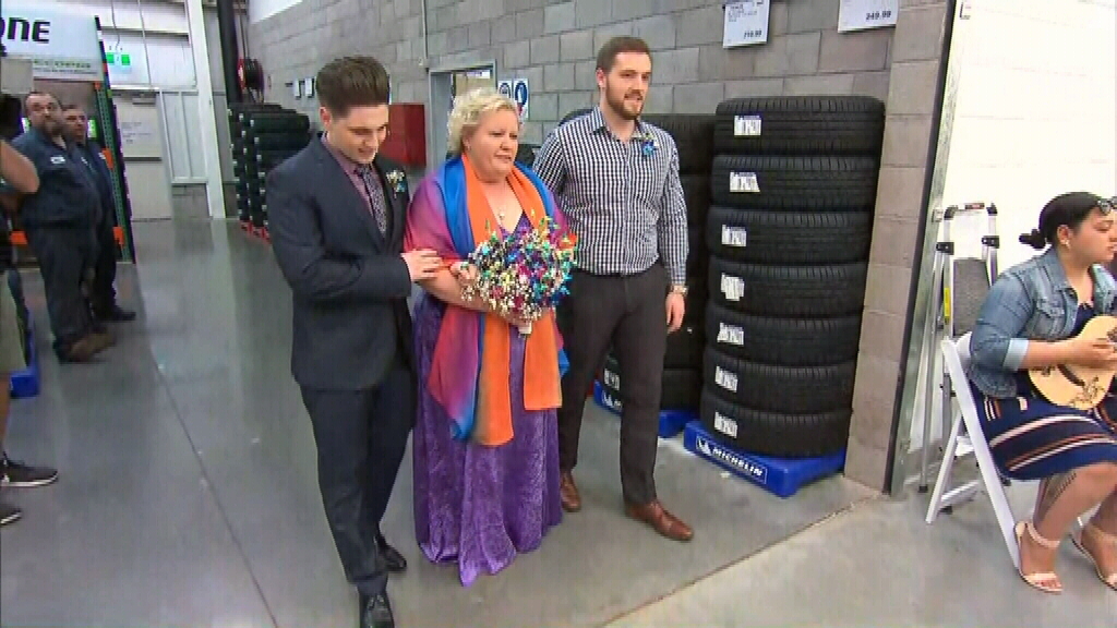 Blushing Bride Walks Down The Tyre Aisle For Dream Costco Wedding