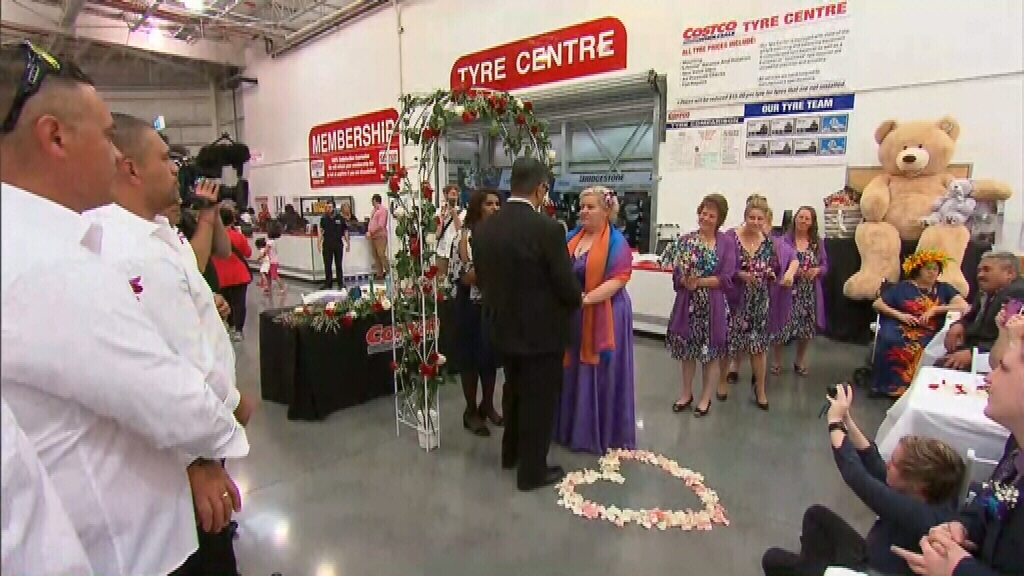 Blushing Bride Walks Down The Tyre Aisle For Dream Costco Wedding