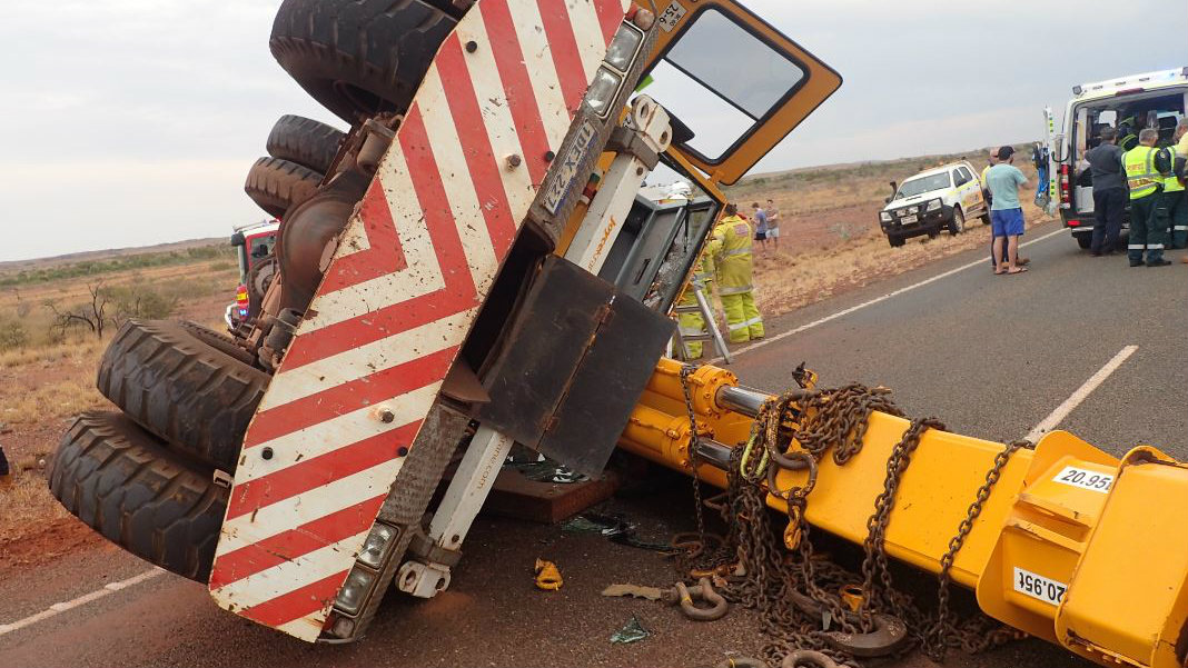 Driver critical after crane crashes, rolls