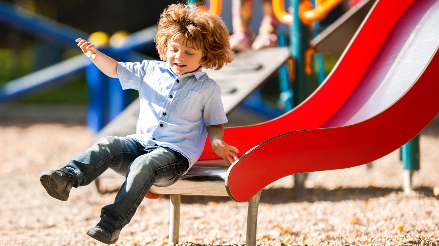 Holding a child in lap on slide increases risk of playground injury