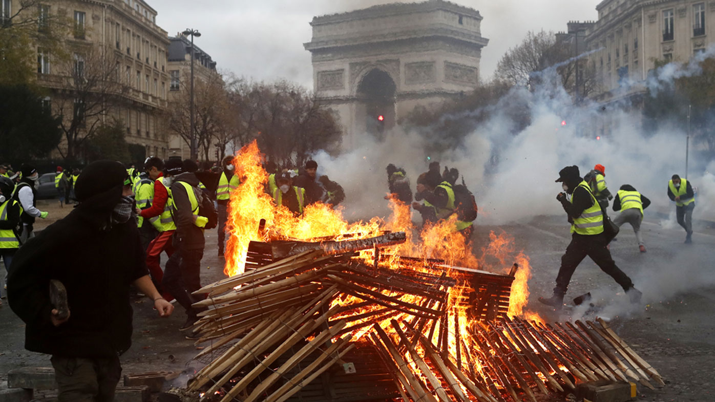 Fiery clashes on the streets of Paris see over 100 arrested