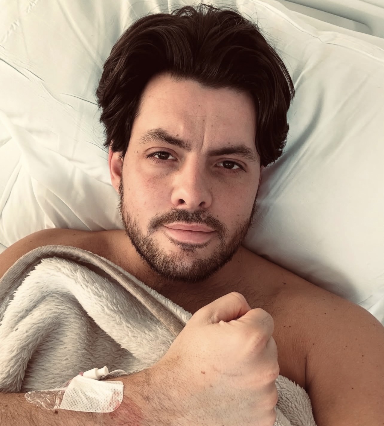 Reality star reveals horror health battle as he's hospitalised with viral meningitis and encephalitis: 'Battered and bruised'
