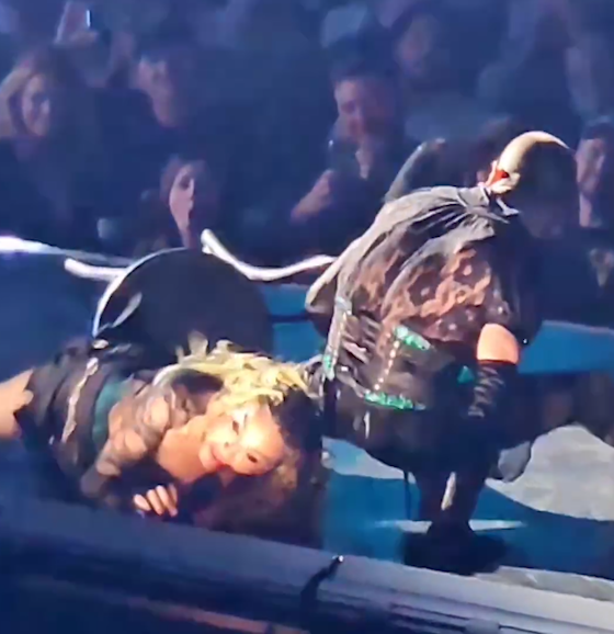 WATCH: Madonna falls backwards off a chair while performing concert in Seattle