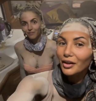 Burning Man attendees head to toe in dust as the extreme weather continues to wreak havoc at the famous festival