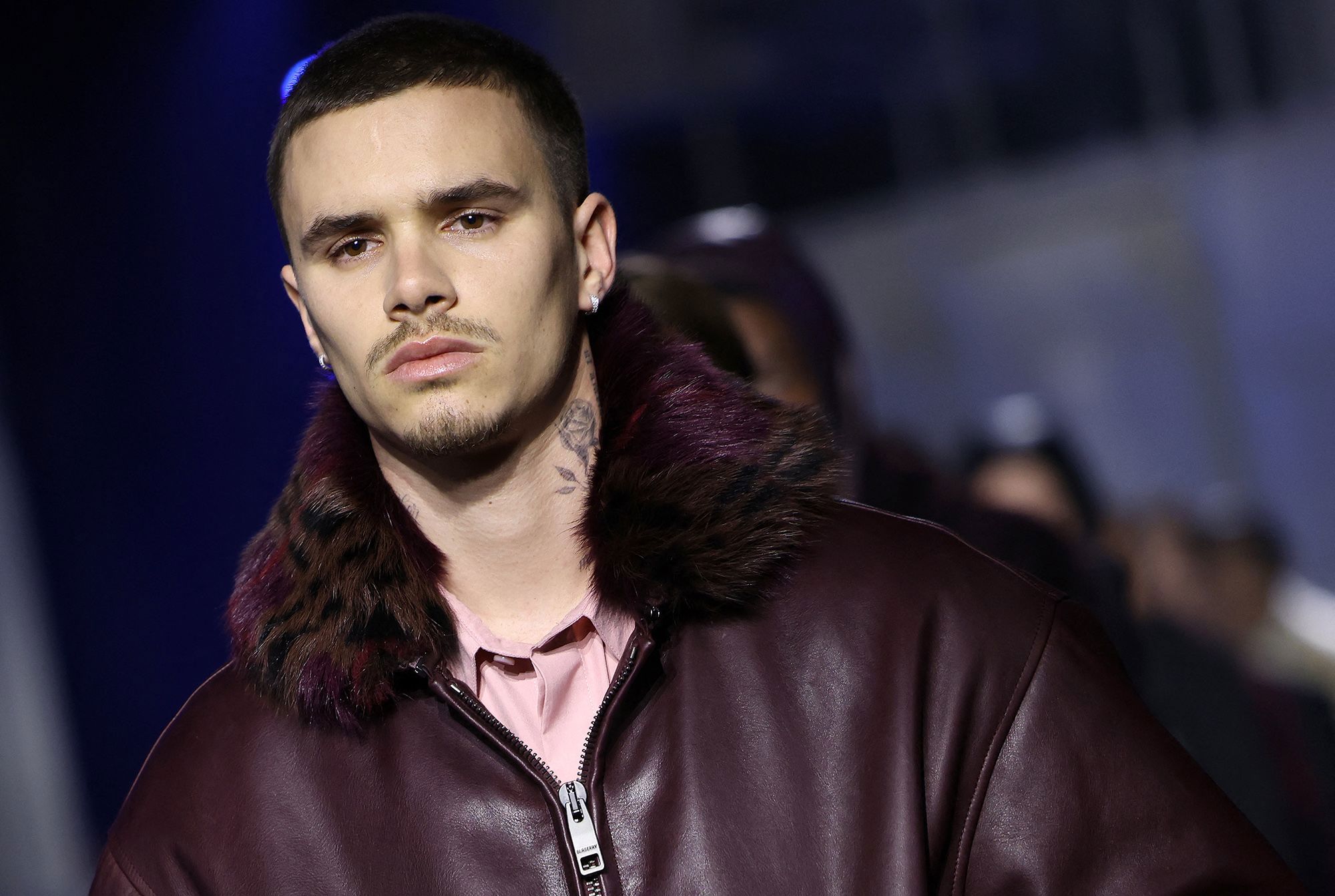 What family feud? Romeo Beckham hits the runway at London Fashion Week