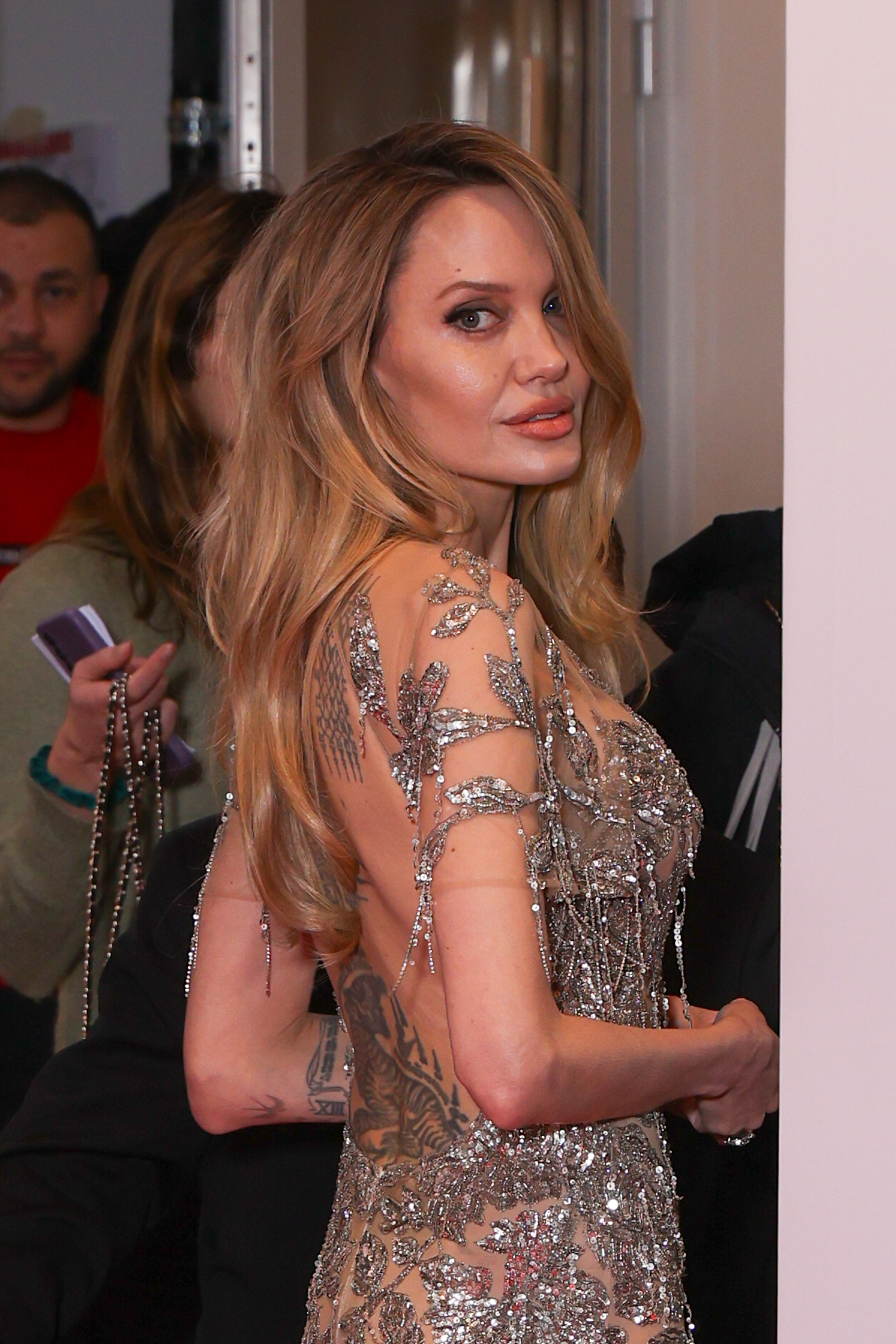 Angelina Jolie stuns in an embellished dress at the Paris premiere of her new film Couture