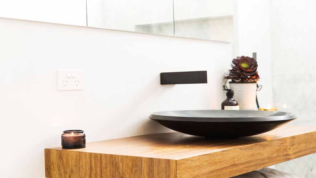 Mixed with the timber details on the vanity and shelf.