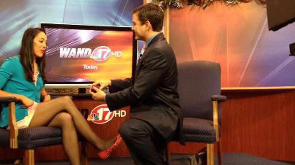 News anchor Mark Rivera proposes to Alissa Groeninger on air yesterday.