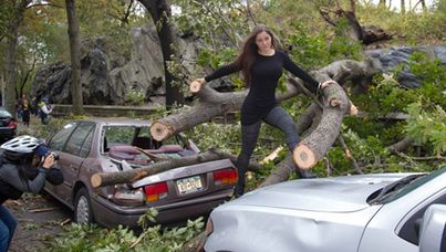 Brazilian model/actress Nana Gouvêa poses amidst debris after superstorm Sandy.