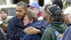 President Barack Obama comforts storm victim Donna Vanzant in Brigantine, New Jersey. (AAP)