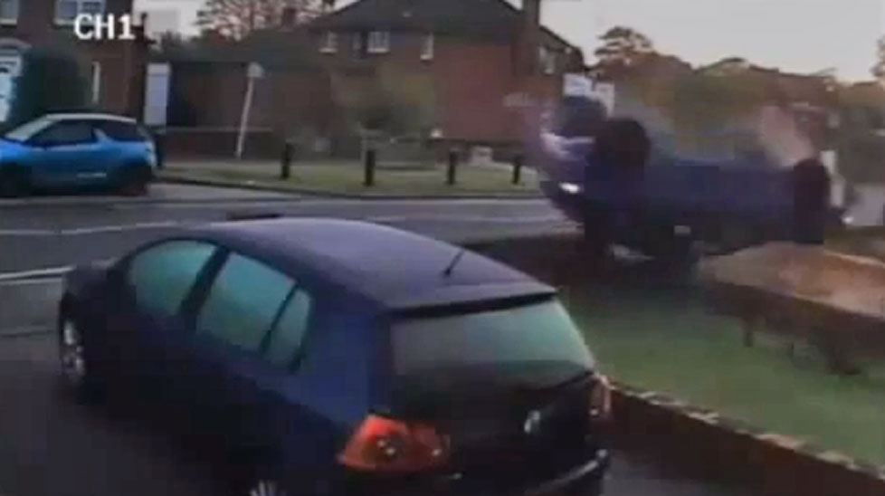 A drunken UK driver has escaped without a scratch after his car flipped into a front yard.