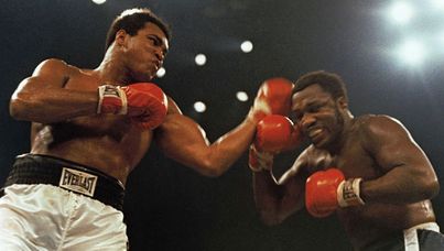Muhammad Ali lands a blow against Joe Frazier in 1974. 
