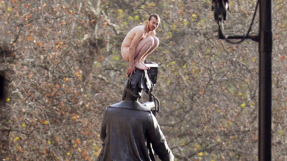 A naked man atop a statue in Whitehall, London. (AAP)