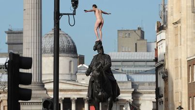 A naked man on a statue of George, Duke of Cambridge in Whitehall, London. (AAP)