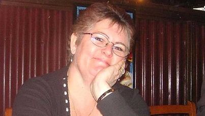 The family of a woman murdered on Halloween last year are calling on the public to help solve the brutal crime.