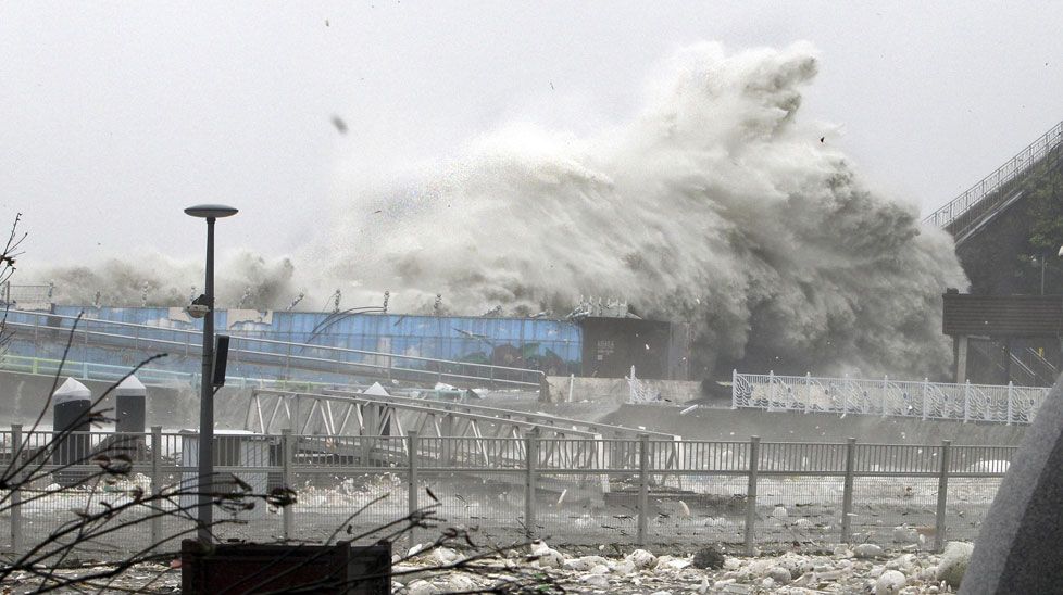 High waves, caused by Typhoon Sanba, crash on a seaside road in Yeosu, south of Seoul. (All photos AAP)