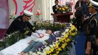 Mourners pay tribute to Zeng Jia, who feigned death for her funeral in Wuhan, China. (AAP)