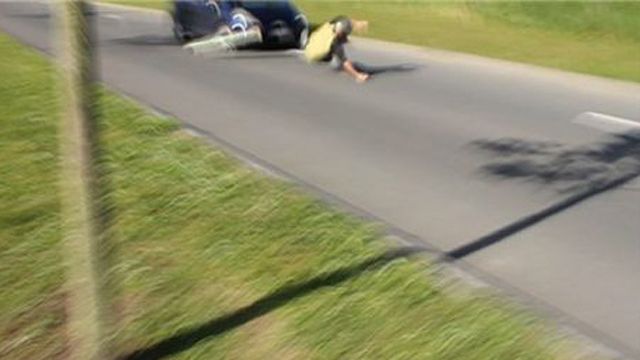 The moment when the boy falls in front of the car.