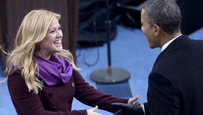 President Obama greets Kelly Clarkson, who performed "My Country, 'Tis of Thee".
