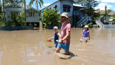 Floodwaters are seen in Torwood street, in the inner city suburb of Rosalie in Brisbane. (AAP)