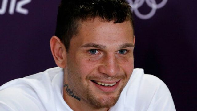 Boxer Damien Hooper has been charged with exposing himself and assaulting a police officer