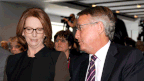 Prime Minister Julia Gillard speaks to federal treasurer Wayne Swan. (AAP)