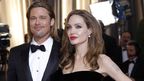 Angelina Jolie (right) with partner Brad Pitt at the Academy Awards last year.
