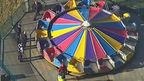 The boy fell 10m from a fast-spinning carnival ride.