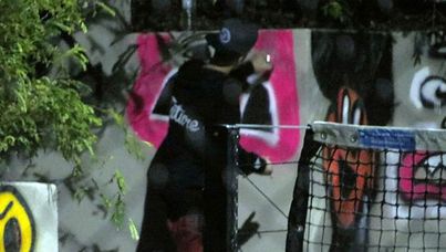 Justin Bieber spraypaints a 'Pacman ghost' on a wall of the QT Hotel in the Gold Coast Wednesday morning. (Supplied)