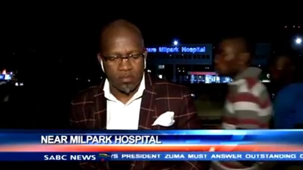 South African news presenter Vuyo Mvoko waiting for the live cross