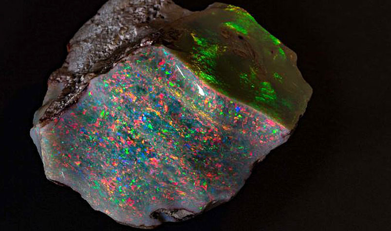The 'Fire of Australia' opal was mined by Walter Bartram at Coober Pedy in 1946 and kept by his family ever since. (South Australian Museum)