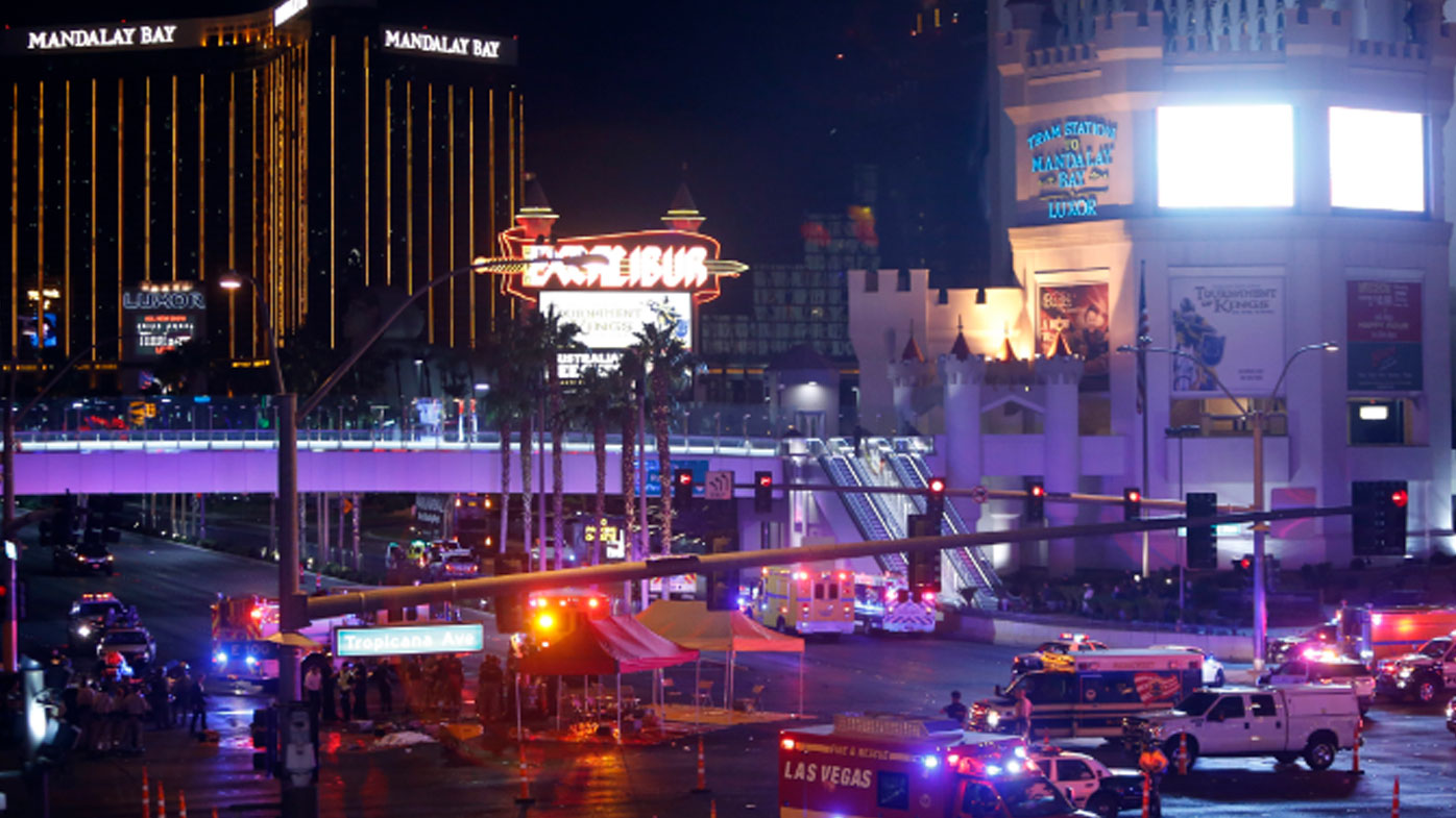 Las Vegas Metro Police and medical workers block off an intersection after a mass shooting at a music festival on the Las Vegas Strip on Sunday, Oct. 1, 2017. (Steve Marcus/Las Vegas Sun via AP)