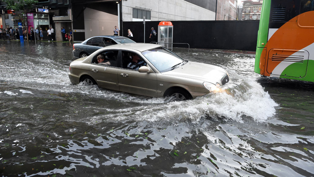 IN PICTURES: Wild storms bring hail, flash floods to SE Queensland