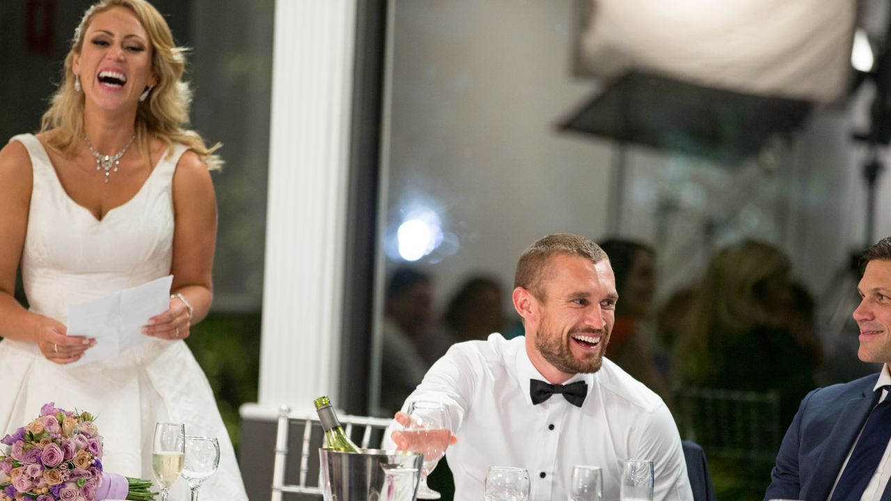 Clare and Jono share laughs at their Reception.
