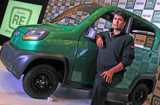 Bajaj Auto managing director Rajiv Bajaj poses with the RE60 in New Delhi. (Getty)