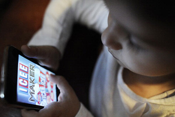 Child using app on iPhone