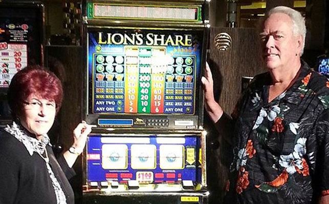 Walter and Linda Misco pose with the Lion's Share.