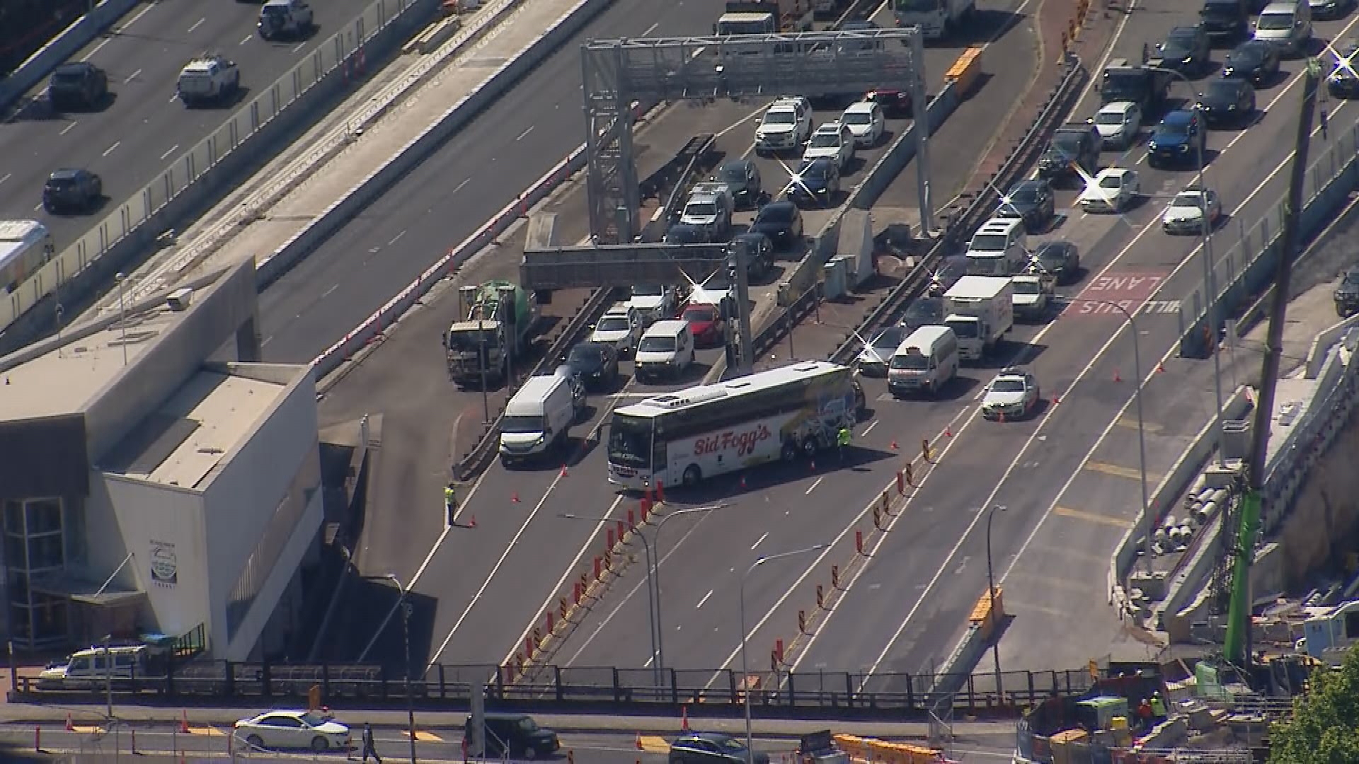 A man has died and another is fighting for life after ﻿three cars and a bus crashed on Sydney's Harbour Bridge about 1.40pm.