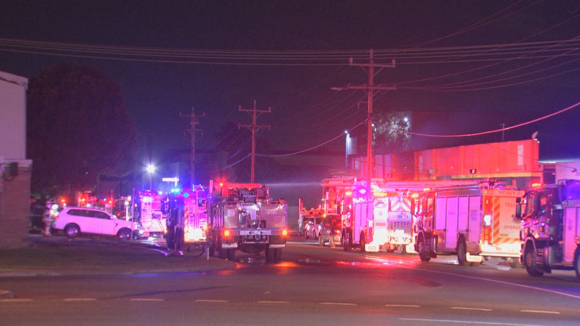A fire ripped through an automotive business in Melbourne overnight after a car crashed into the building.
