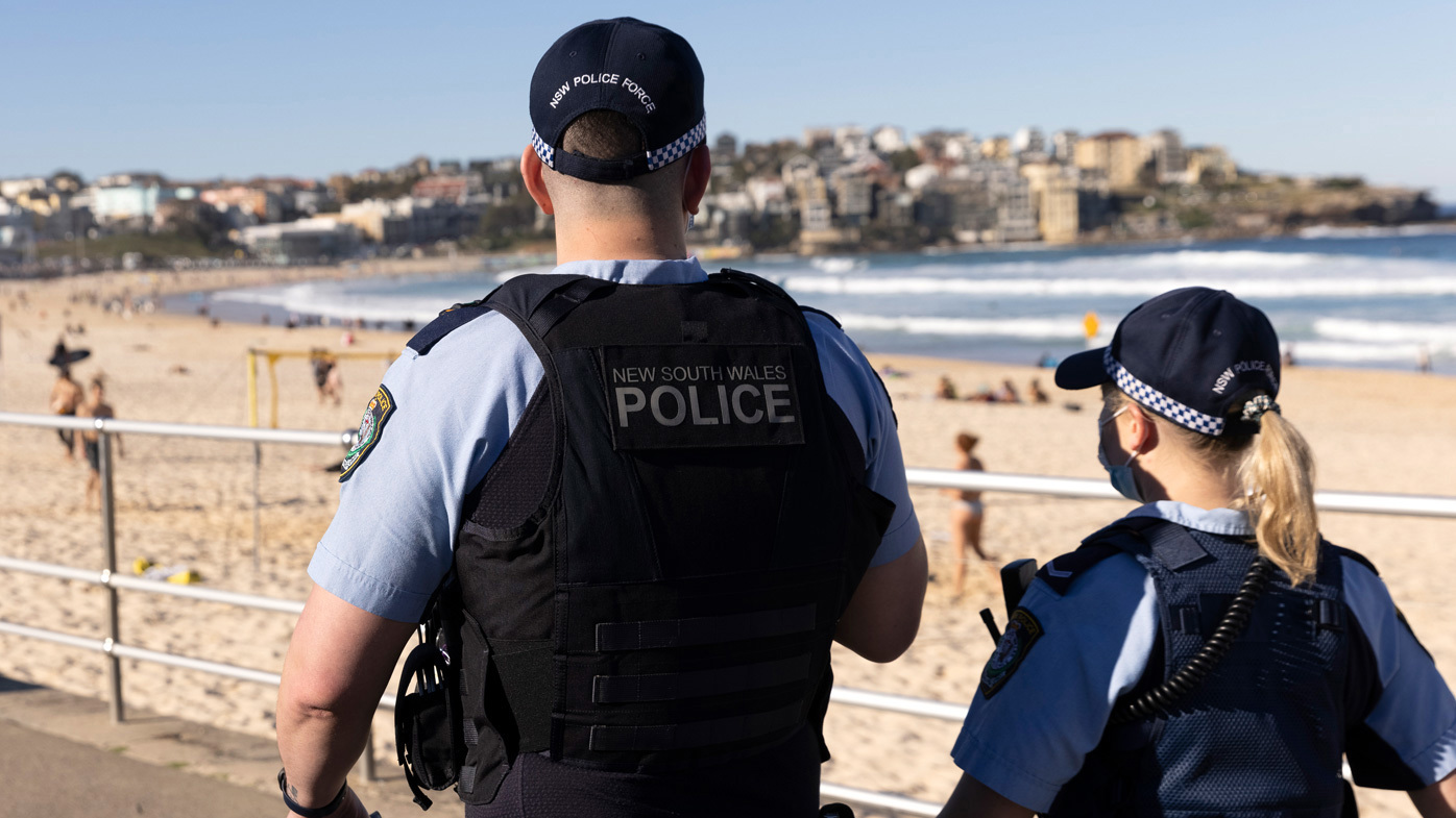 Police patrol Bondi Beach during Sydney's latest COVID-19 lockdown.
