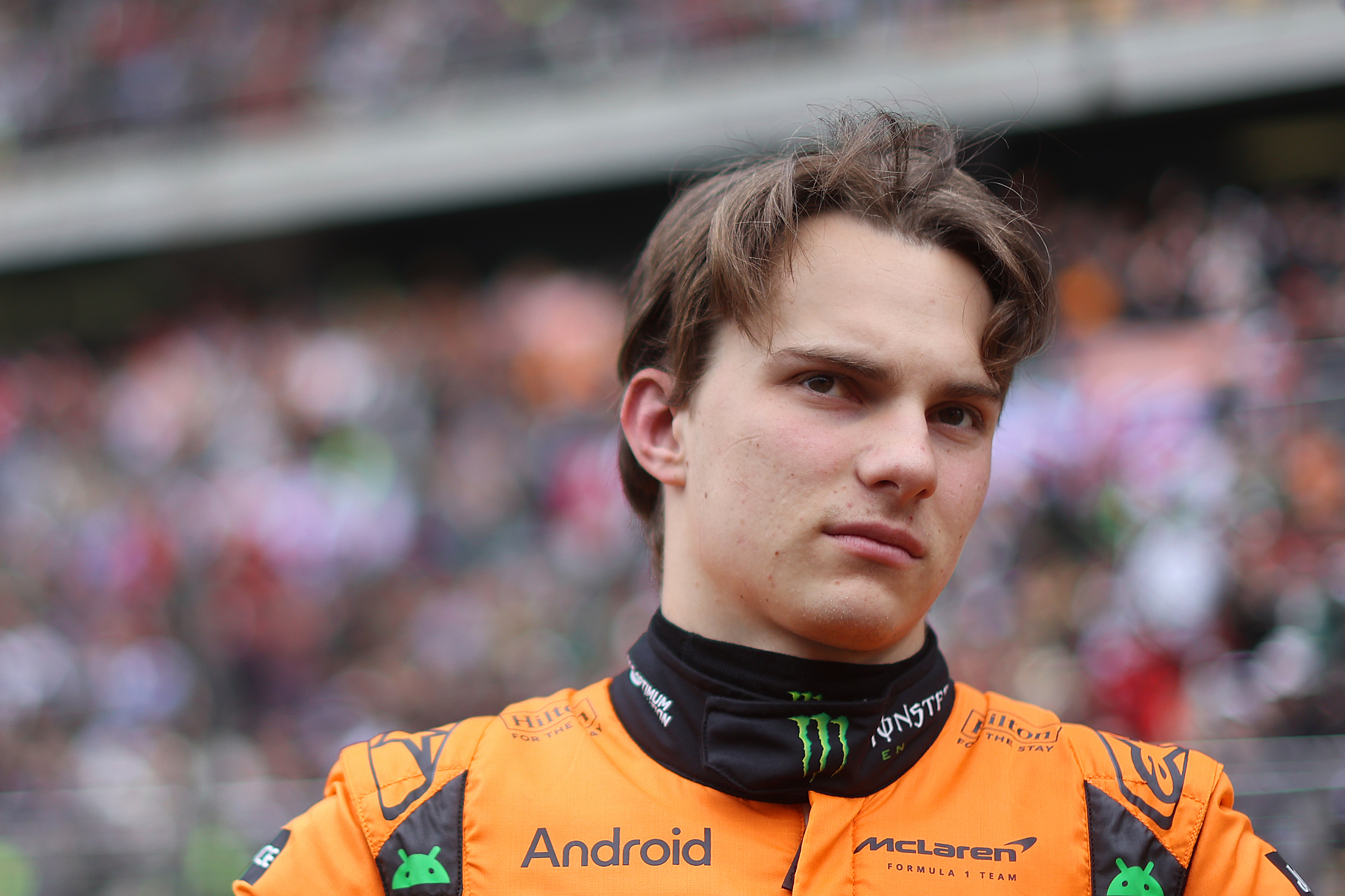 Oscar Piastri of Australia and McLaren looks on.