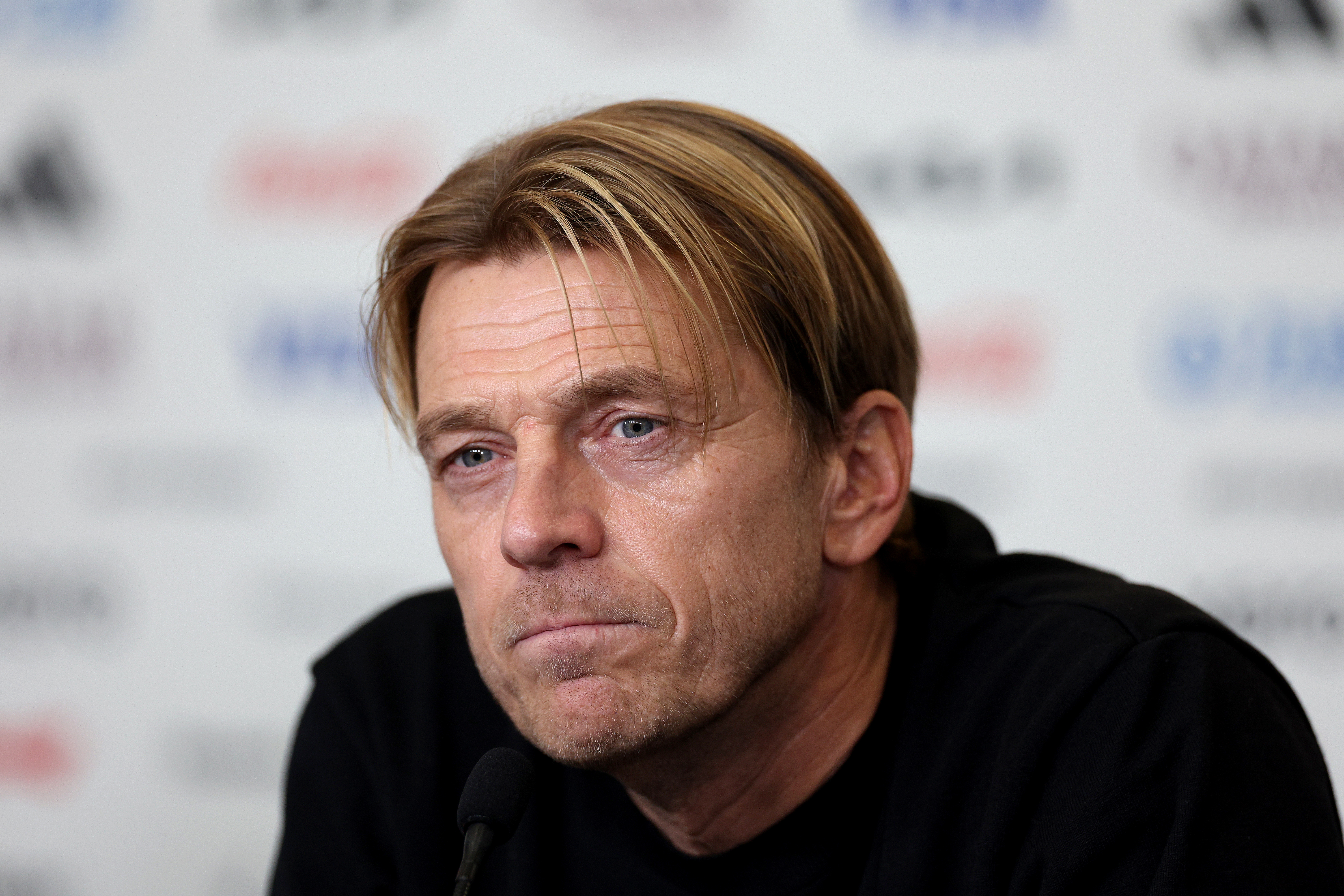 BRISBANE, AUSTRALIA - JULY 26: Head coach Tony Gustavsson of Australia answers questions during a press conference at Brisbane Stadium on July 26, 2023 in Brisbane, Australia. (Photo by Elsa - FIFA/FIFA via Getty Images)