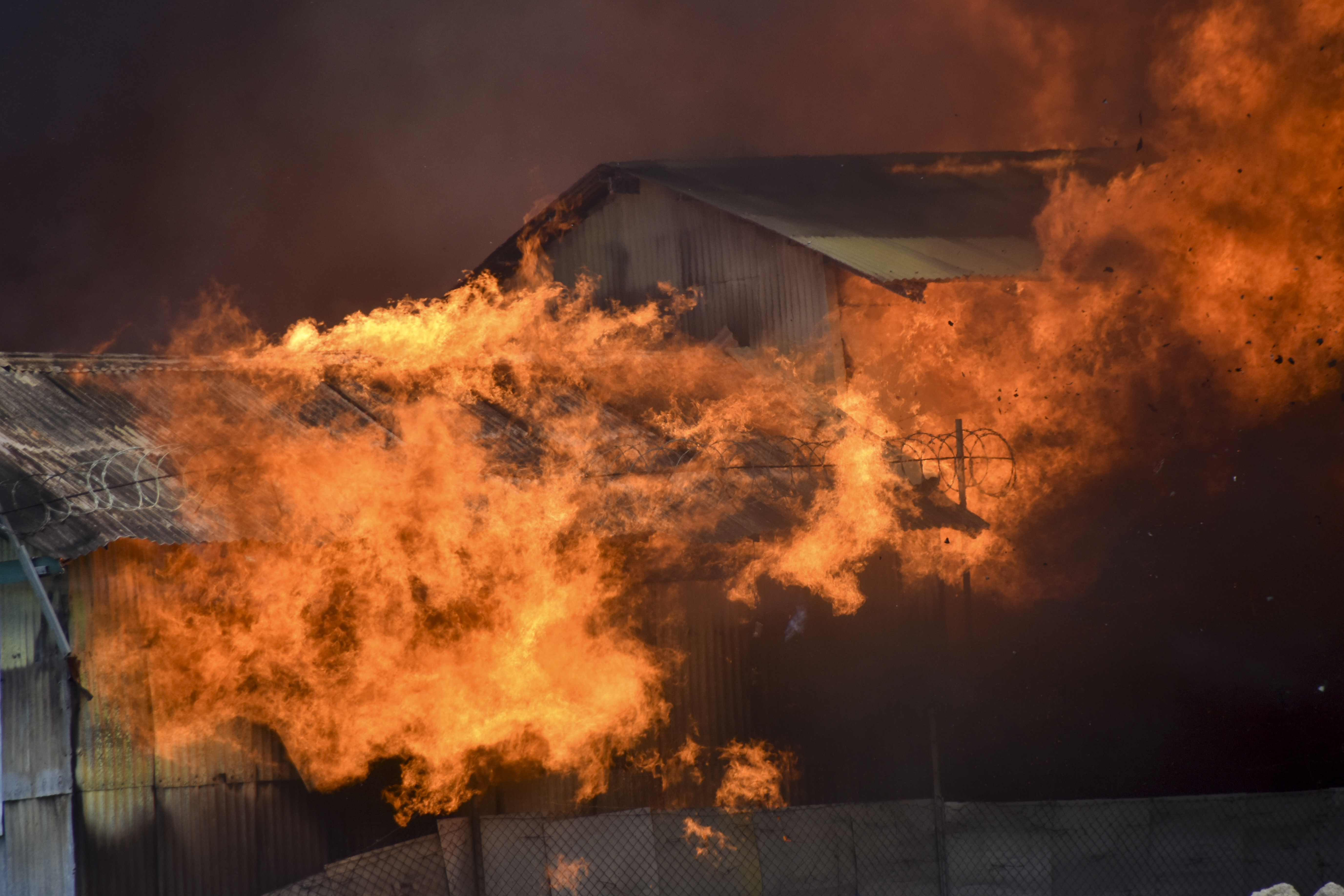 A building burns in Chinatown, Honiara, Solomon Islands