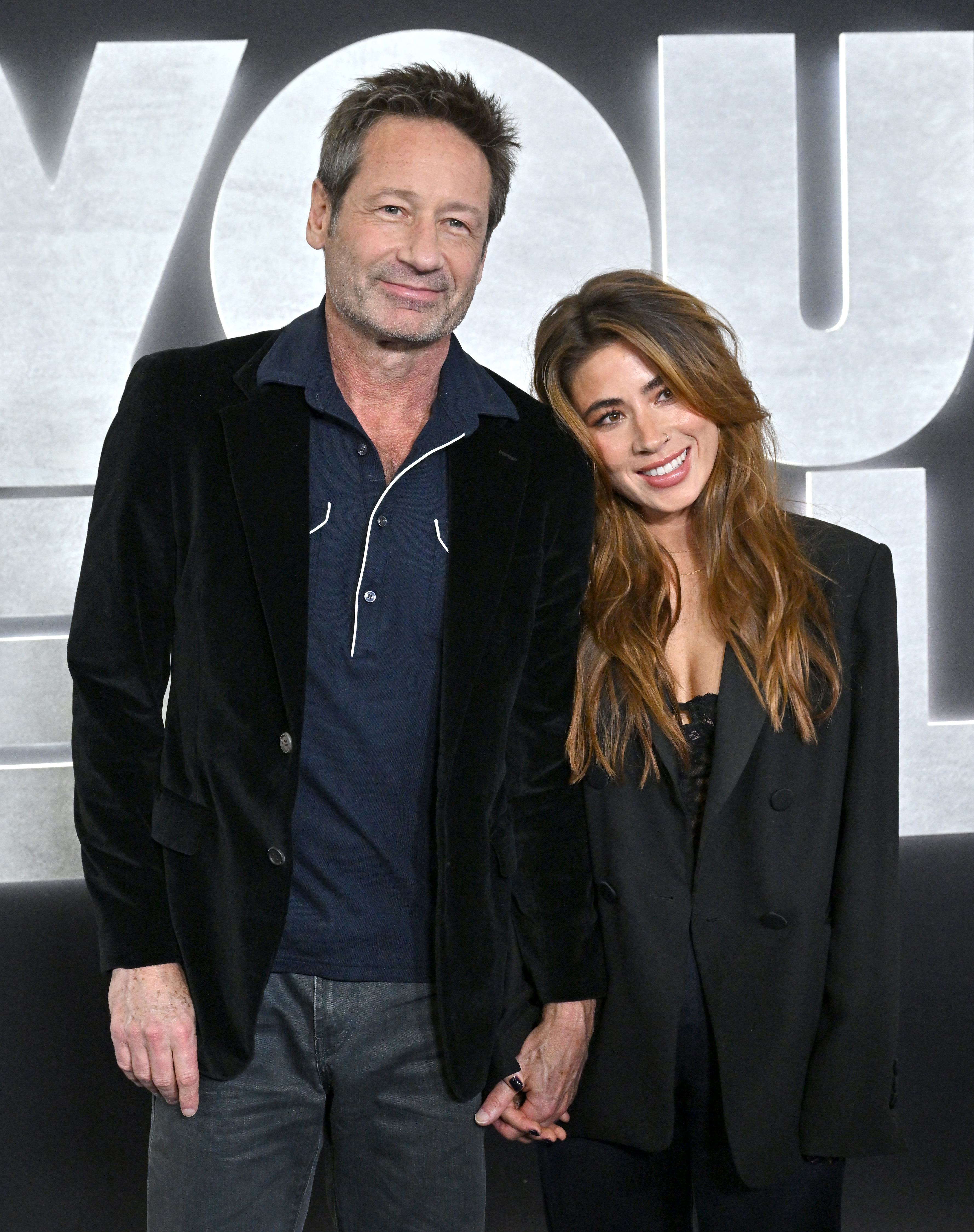 David Duchovny and Monique Pendleberry attend the Los Angeles Premiere of Netflix's You People at Regency Village Theatre on January 17, 2023 in Los Angeles, California.