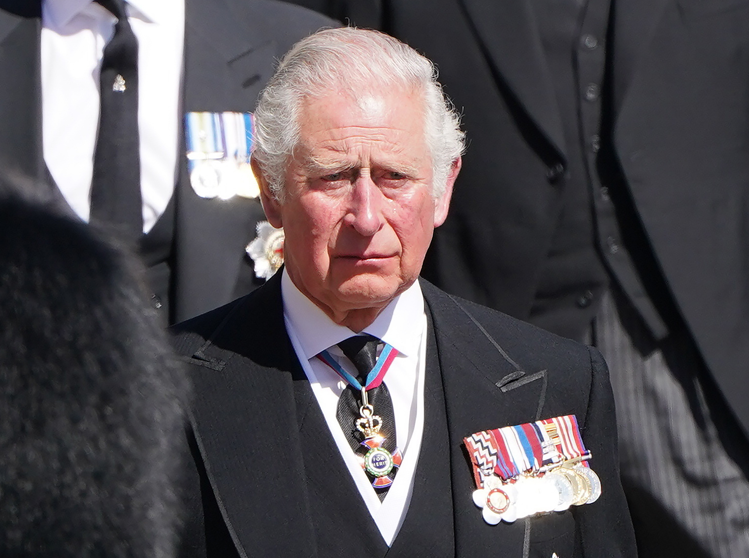 FILE - In this April 17, 2021 file photo, Prince Charles with other family members follow the coffin during a procession arriving at St George's Chapel for the funeral of Britain's Prince Philip inside Windsor Castle in Windsor, England. Prince Charles has been preparing for the crown his entire life. Now, that moment has finally arrived. Charles, the oldest person to ever assume the British throne, became king on Thursday Sept. 8, 2022, following the death of his mother, Queen Elizabeth II. (Pa