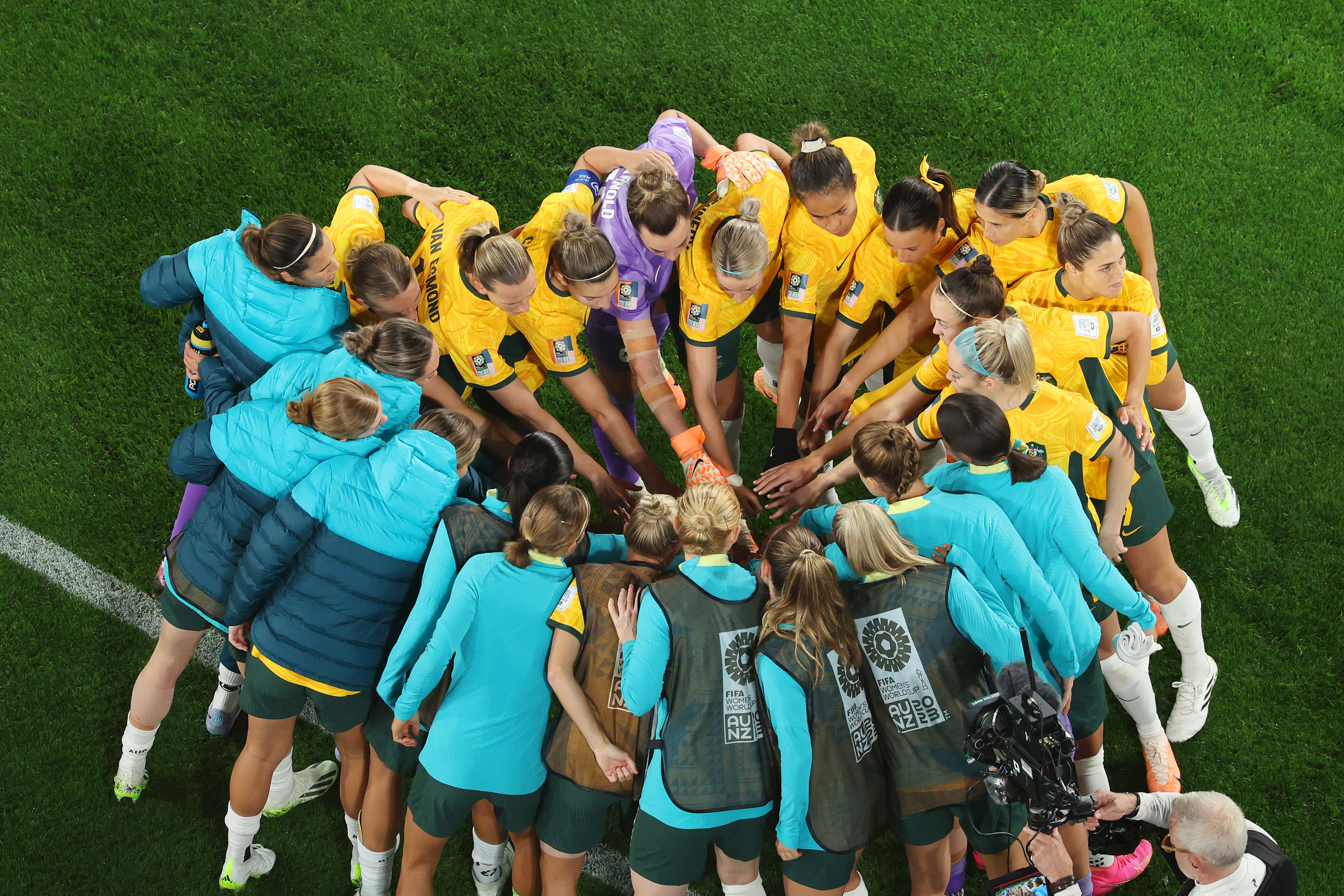 Australia huddle up ahead of their round of 16 match against Denmark.