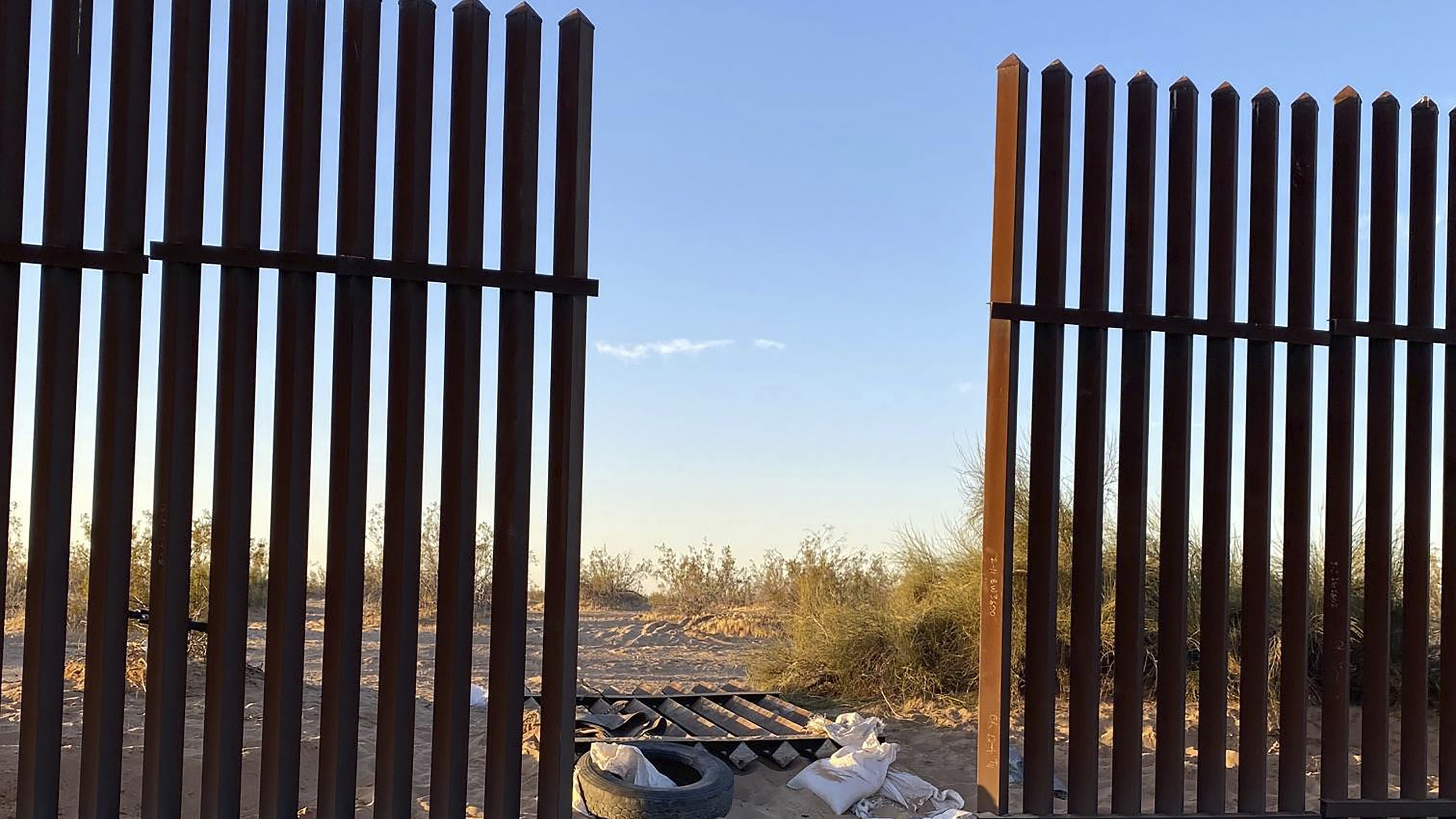 A hole cut in the border fence between Mexico and California, believed to be where the car entered the US.